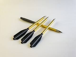 Arrows for a training crossbow on a white background. Set of four. Three lie on one.
