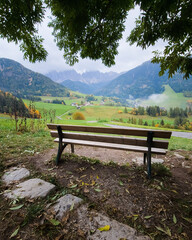 Bench with a view over the Val di Funes and Santa Maddalena village, Dolomites Italy