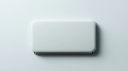 A minimalist, off-white, rectangular button or blank template on a light gray background.