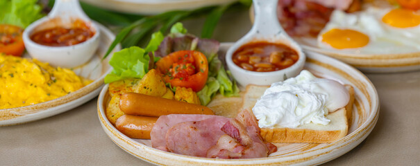 Breakfast with fried eggs and bacon and sausage. Breakfast set at hotel. Hearty Traditional Breakfast Plate with Eggs, Sausage, Bacon, Toast, and Vegetable Salad.