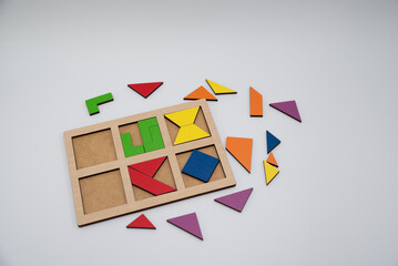 children's puzzles inserts assemble a colored square on a white background
