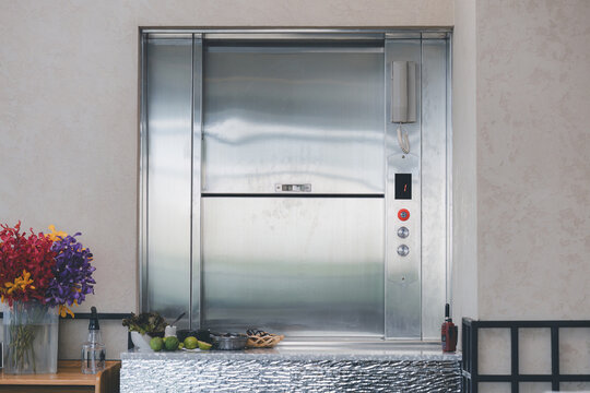 Dumbwaiter Lift elevator in a kitchen of Restaurant or Hotel used for carrying food or goods. Food hoist and food elevator for ready meals. Small Freight Elevators or Dumbwaiters Food Elevators