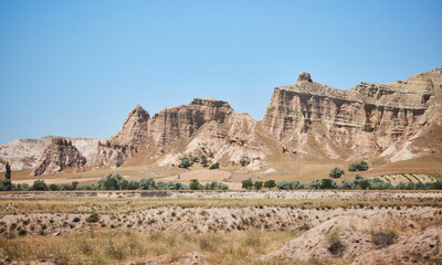 Fototapeta premium Mountain landscape in Cappadocia, Central Anatolia region, Turkey. Tuff mountains.