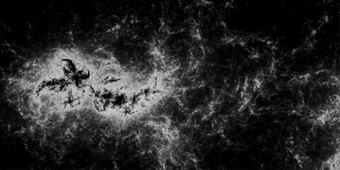 Abstract black and white modern design with grunge and marbled cloudy design. Gray rough grainy stone texture splashes and flying drops of water on a dark background. Chalkboard texture, space view 