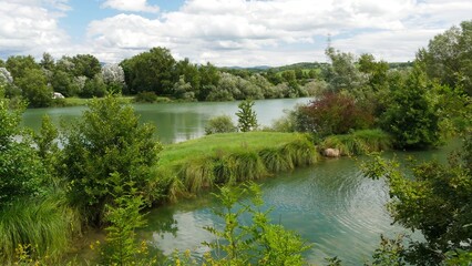 Scenic View of a Serene Lake with Lush Green Surroundings