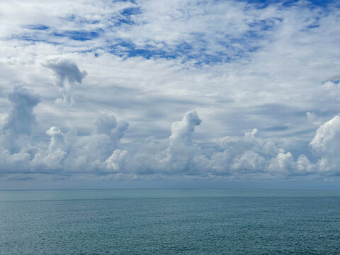 Stunning clouds over blue ocean water.