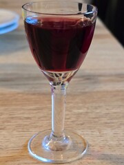 glass of red wine on table