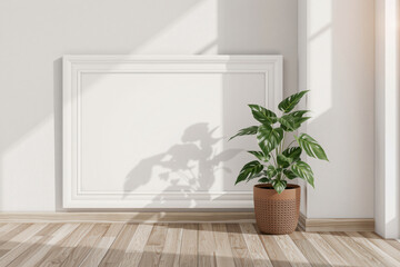 blank frame on wall in bright room with potted plant, creating serene atmosphere. sunlight casts soft shadows, enhancing peaceful ambiance