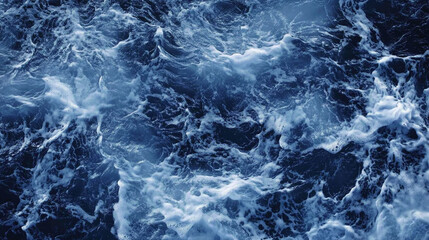 Fototapeta premium Waves crashing in deep blue ocean during a sunny day at the beach