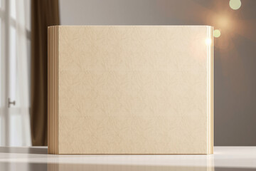 minimalist book mockup with textured cover, placed on table in well lit room. soft light creates warm atmosphere, perfect for showcasing design