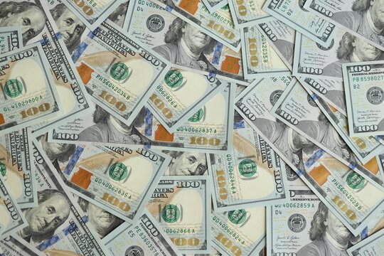 Big amount of american USD hunderd dollar bills banknotes close up