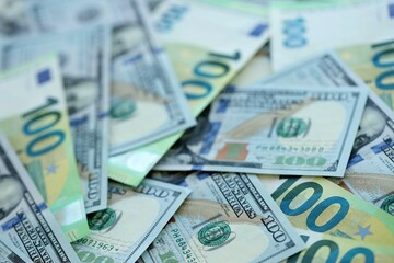 Big pile of Euro and USD banknotes. Many european and united states dollars