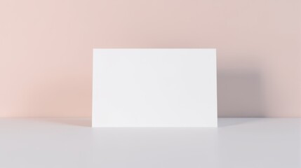 Naklejka premium A blank white paper floats against a soft gradient background, creating a minimalist and modern feel