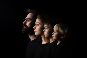 family portrait on black backgroung mother father boys