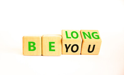 Belonging and belong symbol. Concept words Be you Belong on beautiful wooden block. Beautiful white table white background. Business motivational belonging and belong concept. Copy space.