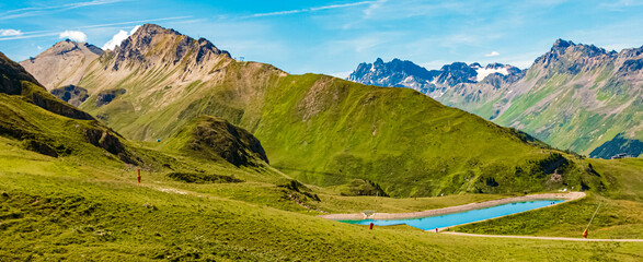 Alpine summer view with a lake at Mount Flimjoch, Ischgl, Paznaun, Silvretta, Landeck, Tyrol, Austria
