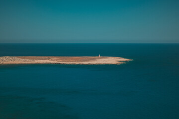 Small Island in Calm Azure Waters