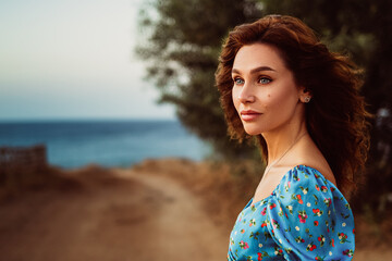Portrait of a Woman in a Blue Dress by the Shore
