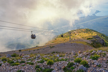 Beautiful autumn mountain landscape. Montenegro, Kotor-Lovcen cable car. Clouds in mountains,...