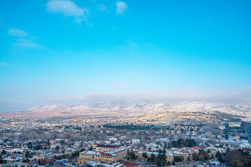 Fototapeta premium The scenic views of Ürgüp from Temenni Hill, which is located in the center of Ürgüp. Revealing the city panorama with its height of 80 meters, this rocky hill, can be seen from all over Ürgüp.