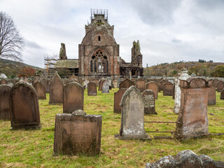 Fototapeta premium The Sweetheart Abbey from the 19th century with graveyard in New Abbey, Scotland