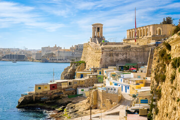 Valletta, Malta - February 9, 2024: Panoramic view of Grand Harbour with public beach and small...