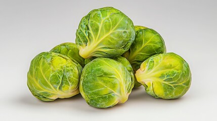 Fototapeta premium Fresh Brussels Sprouts Piled on a Light Background
