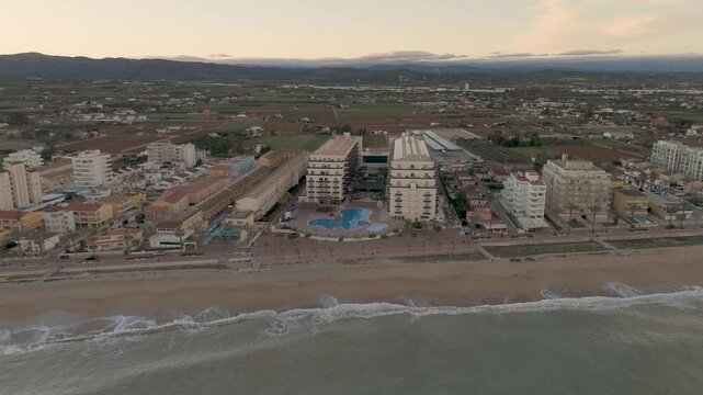 Drone aerial view of a beach in a coudy day in Peniscola