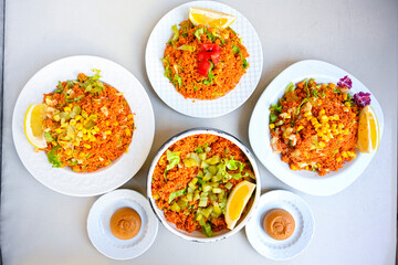 Delicious meat kebab with fresh vegetable salad served with variety of Turkish dishes and appetizers. Top view of assorted Turkish food and meze, tasty and healthy Mediterranean cuisine.