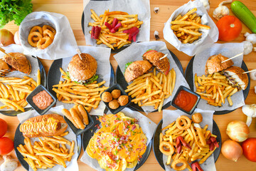Big tasty burger with beef cutlet on a plate. Hamburger, cheeseburger with mushroom. Hamburger, Mexica, mushroom double burger.  Crispy chicken burger. With french fries, patates kizartmasi.