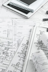 ArchitectТs deskdetailed blueprints, sketches,drafting tools.professional workspace showcasing the creative process of architectural design, planning, and innovation. Ideal. industry-themed visuals