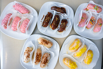 Ekler Pasta Turkish delicious ekler pasta with plate. Klasik, cikolatali, muzlu, frambuazli, karamelli, cilekli, oreolu ekler.