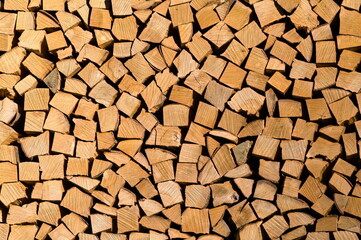 Pile of stacked firewood. Natural background.