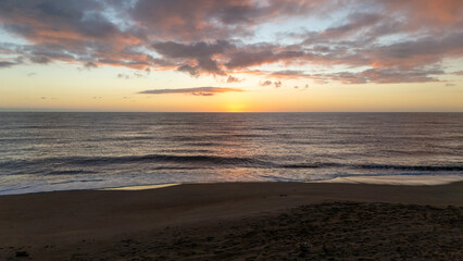 Fototapeta premium Drone aerial view of a sunset on a beach near Peniscola in Spain.