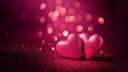 Fototapeta premium Two pink hearts with shimmering bokeh lights on dark pink background