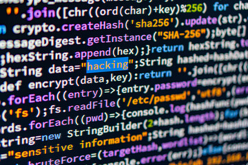 Close-up view of multi-colored computer code on a light gray background, indicative of programming...