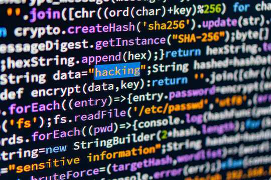 Close-up view of multi-colored computer code on a light gray background, indicative of programming languages or functions No human activity or objects visible apart from the text display Hacking