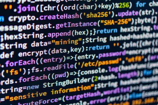 Mining. Close-up image of a colorful code display on a computer monitor, possibly in an IDE, with text related to data processing and security The background is gray