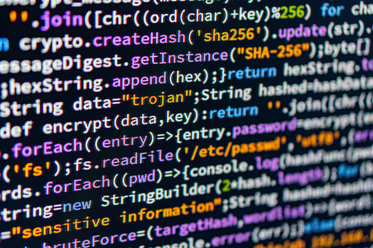 Trojan. Close-up image of colorful code on a computer monitor, with syntax highlighting indicating variables, functions, and keywords 