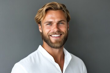Obraz premium Confident Businessman: Handsome Macho Guy with Blond Hair and Beard in a White Shirt, Smiling Against Studio Background