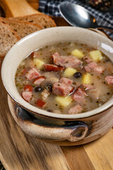 Sour soup with mushroom and potatoes.