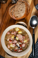Sour soup with mushroom and potatoes.