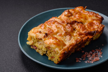 Lasagna or pasta layered with meat, cheese, salt, spices and herbs