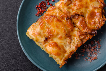 Lasagna or pasta layered with meat, cheese, salt, spices and herbs