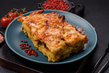 Lasagna or pasta layered with meat, cheese, salt, spices and herbs
