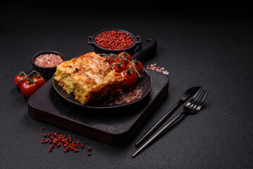 Lasagna or pasta layered with meat, cheese, salt, spices and herbs