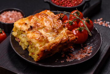 Lasagna or pasta layered with meat, cheese, salt, spices and herbs