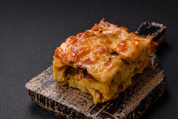 Lasagna or pasta layered with meat, cheese, salt, spices and herbs