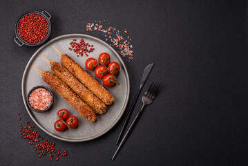 Lula kebab meat fried on a fire in breading with salt, spices and herbs