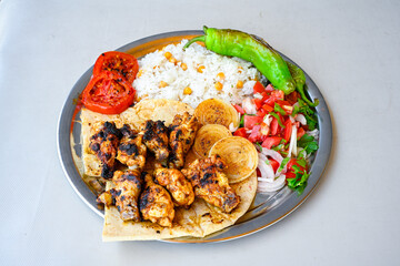 Famous Urfa meat liver, ciger wrapped by lavash with roasted chili pepper, onion and sauce in Sanliurfa, Turkey. Kuzu et ciger sis. Izgara dana bonfile, cop sis, kuzu pirzola. Karisik kebap, beyti keb